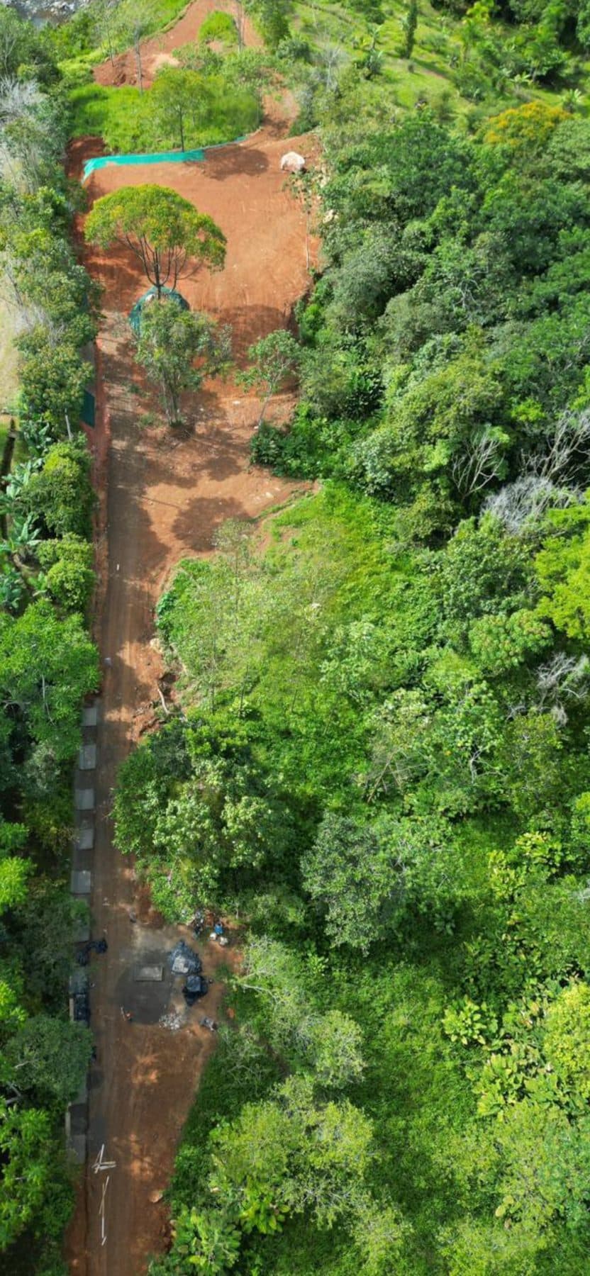 Drone view down the internal road with the drainage channel